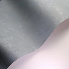 Kép 2/3 - Casadeco Elegáns szürkés kék vlies tapéta kőhatású mintázattal Prague Stone Uni Bleu Orage 53 cm X 10 m