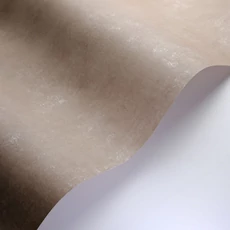 Kép 2/3 - Casadeco Elegáns kékes barna vlies tapéta kőhatású mintázattal Prague Stone Uni Marron Glace 53 cm X 10 m